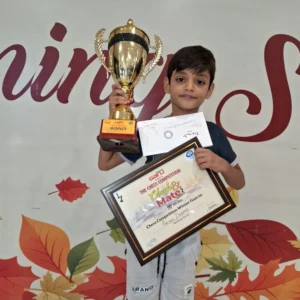 student holding certificate trophy after winning 1st price chess tournament lucknow