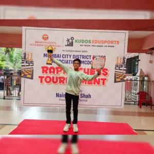 student holding trophy certificate won during chess tournament